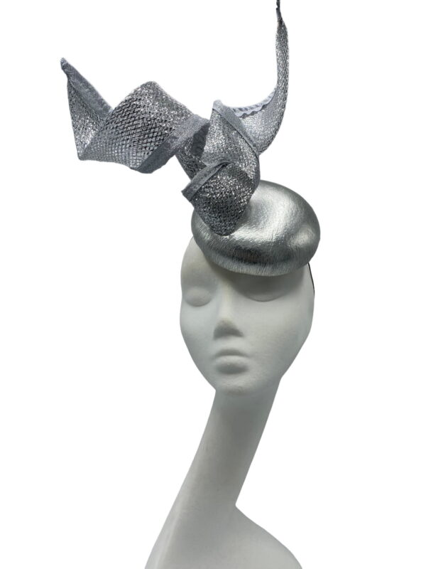 Silver coloured headpiece with shiny silver centre base with a beautiful sparkly swirl intertwined all around the hat and twisted in the centre.